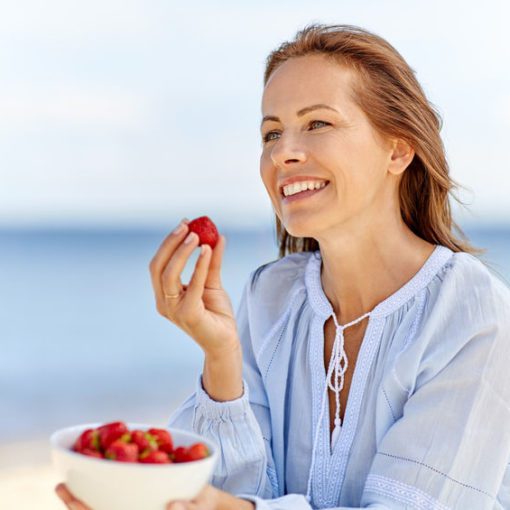 woman eating strawberries