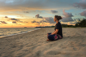meditation benefits for brain
41846180 - woman sitting on beach sand and relaxing at sunset time